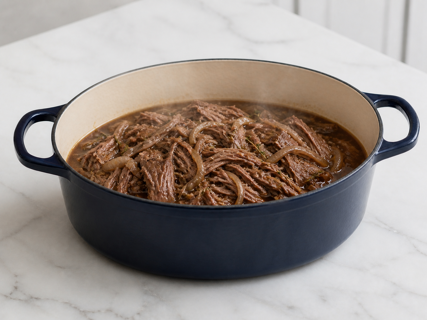 Fork-tender shredded beef in savory au jus