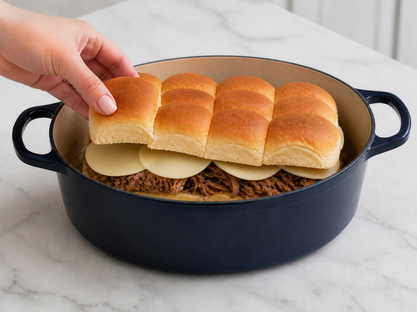French Dip Sliders assembled with shredded beef and provolone